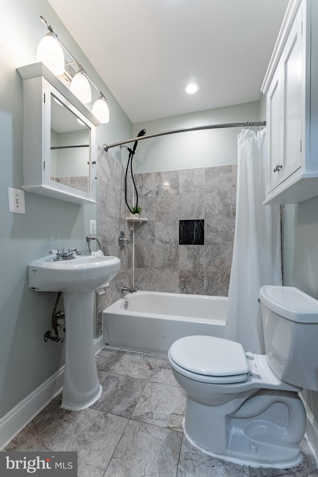 1840 D Street Northeast, Unit 1 Washington, DC 20002 - Photo 20 of 40 a bathroom with a sink toilet and shower