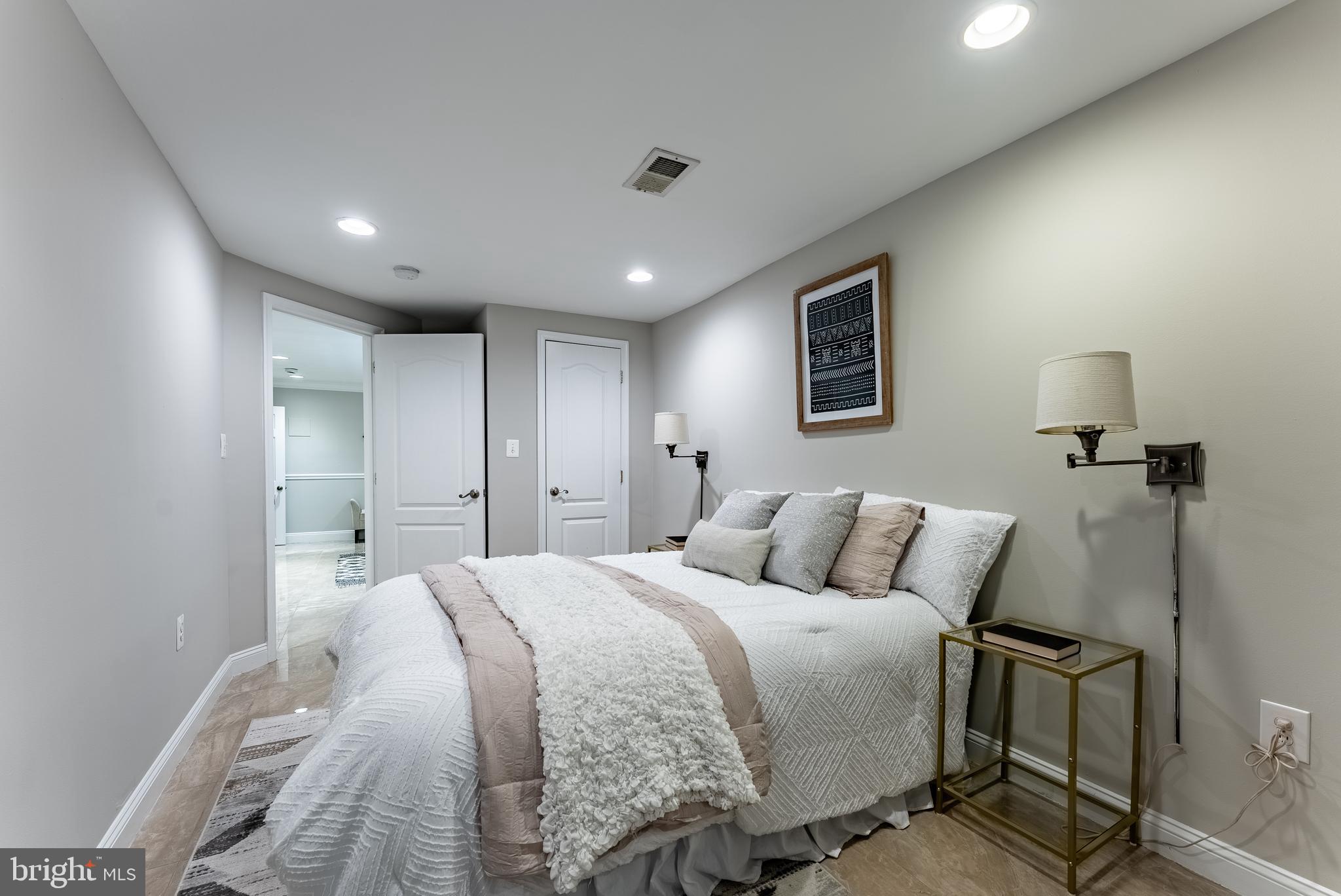 1840 D Street Northeast, Unit 1 Washington, DC 20002 - Photo 21 of 40 a bedroom with a large bed and a couch