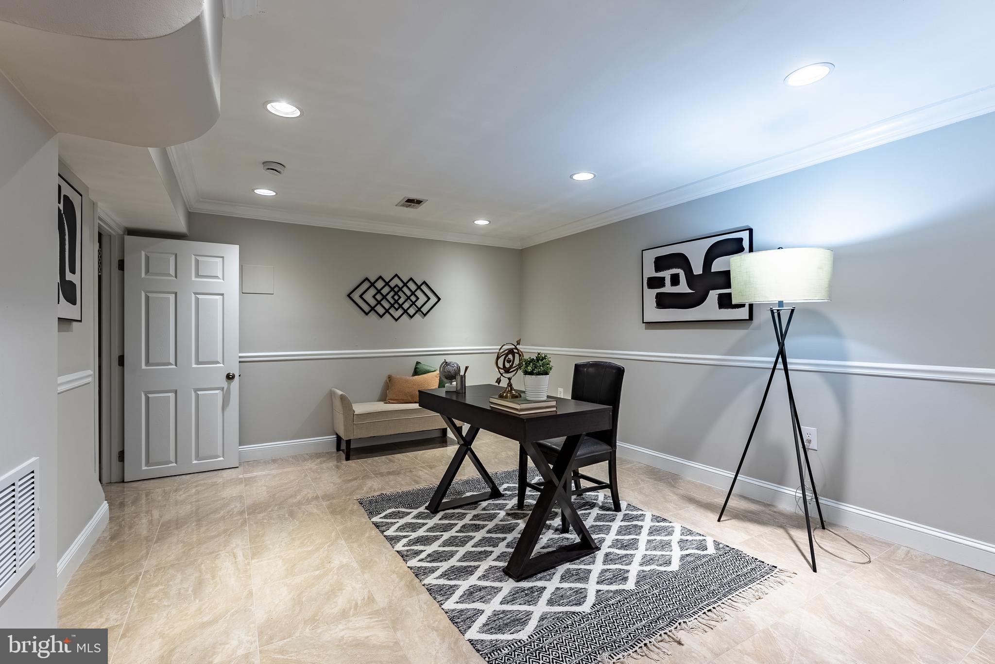 1840 D Street Northeast, Unit 1 Washington, DC 20002 - Photo 24 of 40 a living room with a couch and a rug