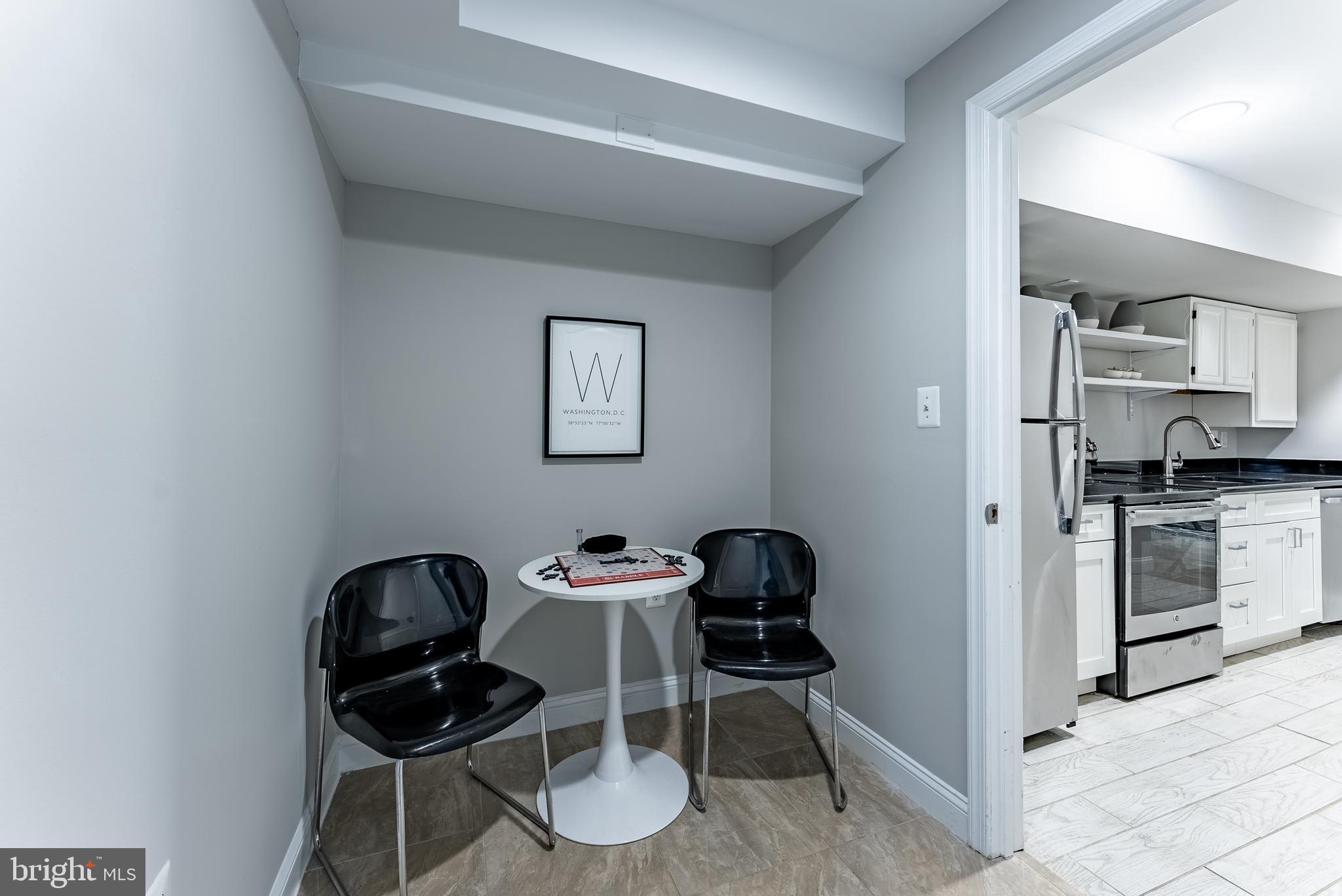 1840 D Street Northeast, Unit 1 Washington, DC 20002 - Photo 28 of 40 a kitchen with stainless steel appliances kitchen island a stove and a refrigerator