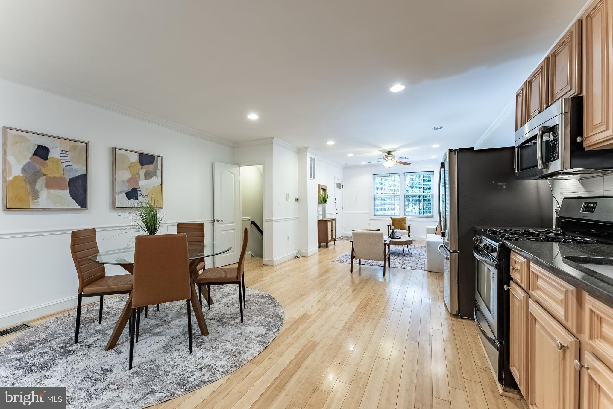 1840 D Street Northeast, Unit 1 Washington, DC 20002 - Photo 10 of 40 a view of a dining room with furniture a rug and wooden floor