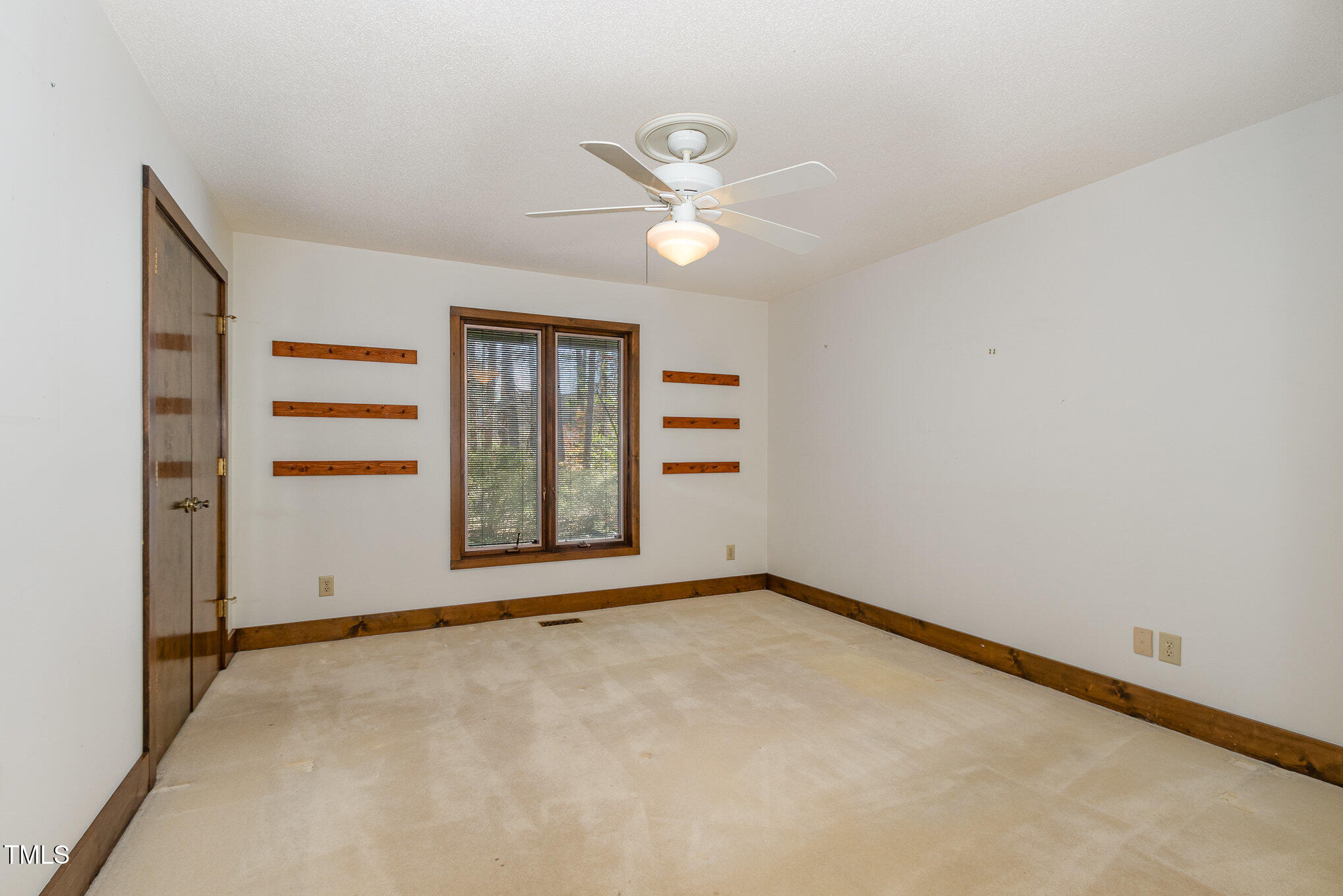 3514 Ridge Road Durham, NC 27705 - Photo 22 of 38 an empty room with windows and closet