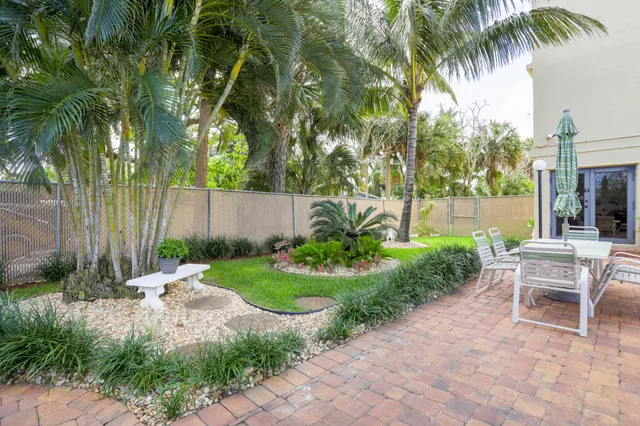 a view of a swimming pool with a lawn chairs