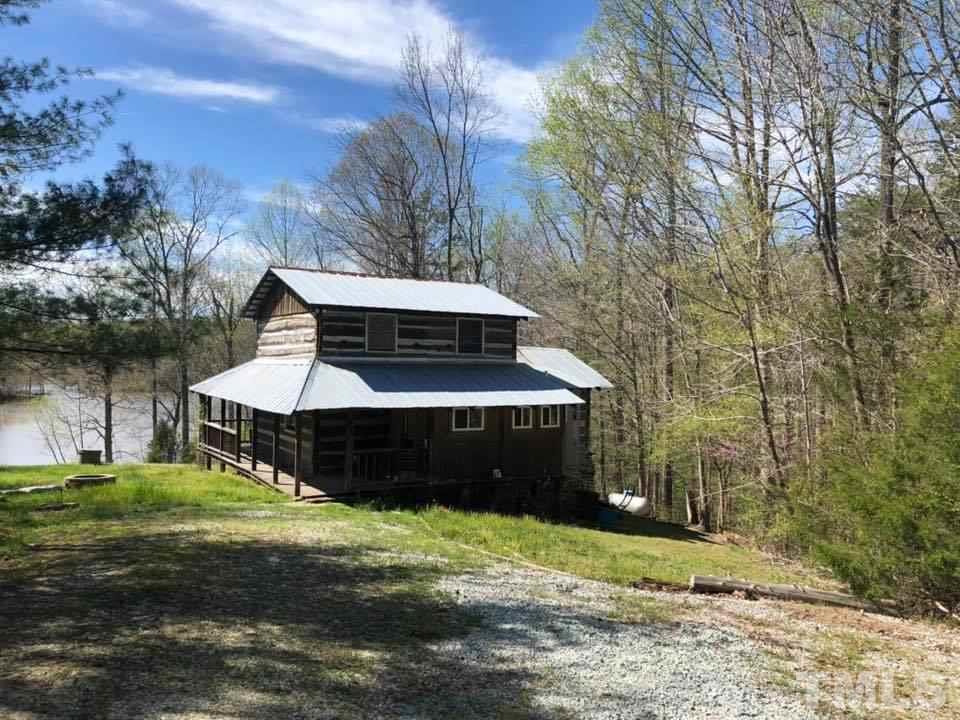 440 Ole Cabin Road Roxboro, NC 27574 - Photo 1 of 23 a front view of a house with a yard