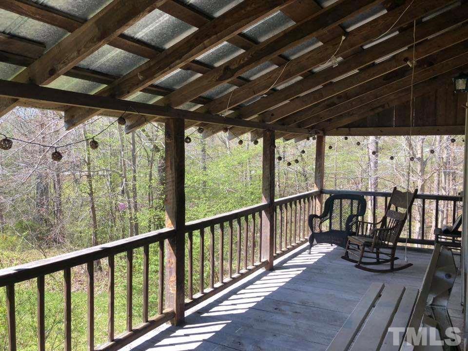 440 Ole Cabin Road Roxboro, NC 27574 - Photo 2 of 23 a view of porch with wooden floor