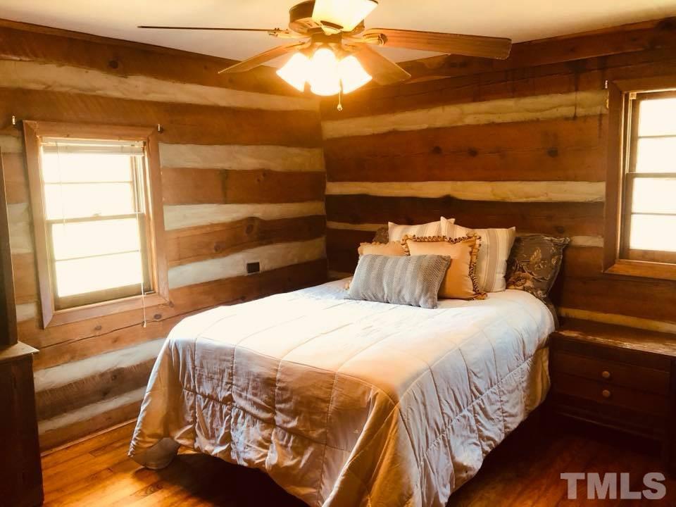 440 Ole Cabin Road Roxboro, NC 27574 - Photo 11 of 23 a bedroom with a bed and a window