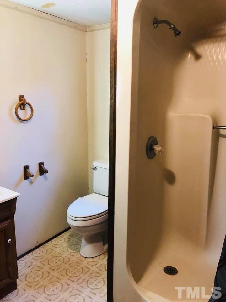 440 Ole Cabin Road Roxboro, NC 27574 - Photo 12 of 23 a bathroom with a toilet and a shower