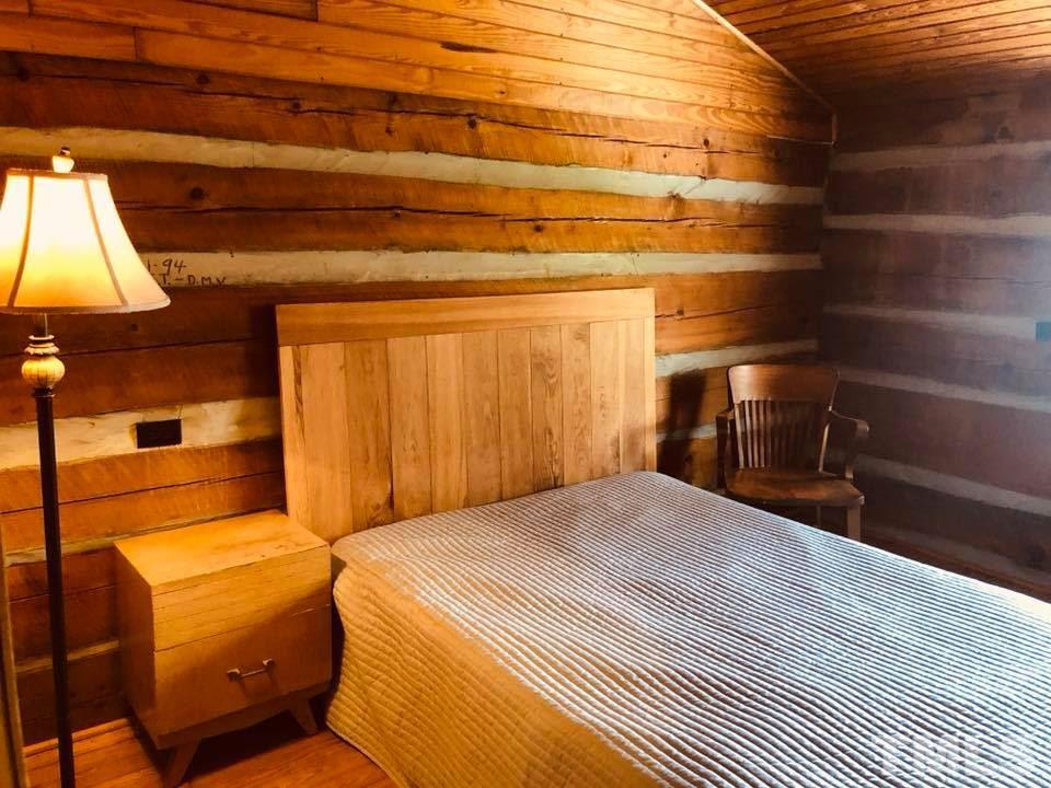 440 Ole Cabin Road Roxboro, NC 27574 - Photo 14 of 23 a bedroom with double bunk beds and painted walls