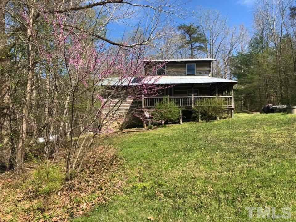440 Ole Cabin Road Roxboro, NC 27574 - Photo 5 of 23 a view of a house with a yard and plants