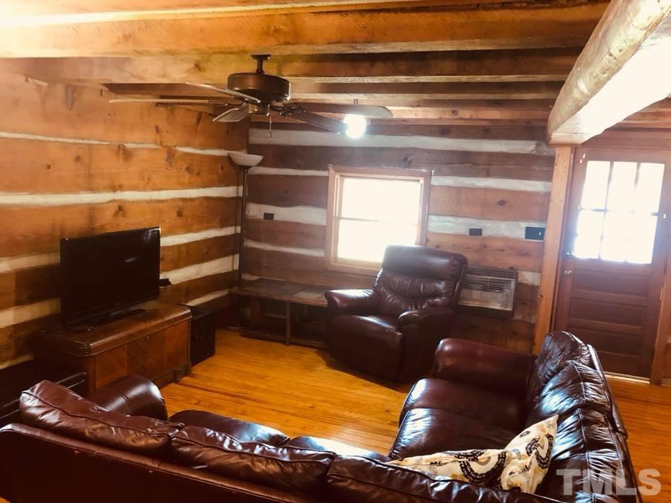 440 Ole Cabin Road Roxboro, NC 27574 - Photo 6 of 23 a room with furniture and a rug