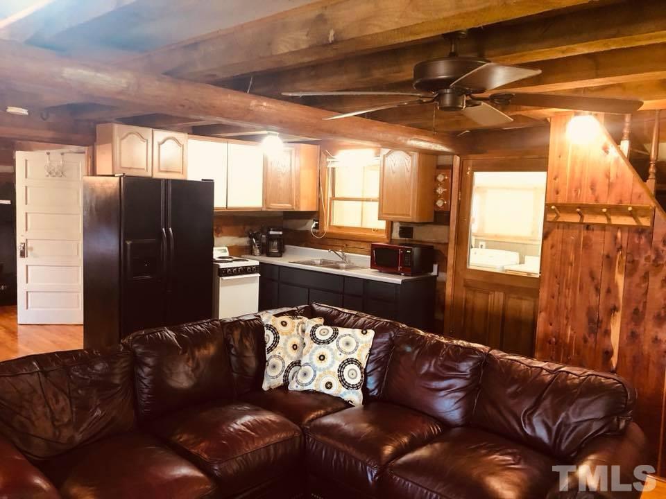 440 Ole Cabin Road Roxboro, NC 27574 - Photo 8 of 23 a living room with a couch and a window