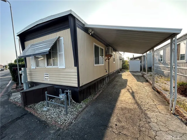 a view of a house with a wooden deck