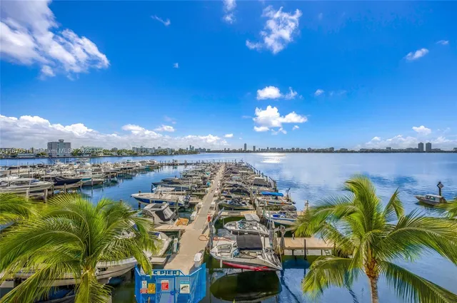 a view of a terrace with lawn chairs