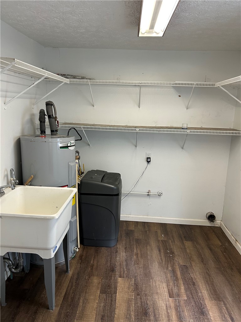 1358 Hanes Road Dayton, OH 45434 - Photo 20 of 21 This dedicated utility space features ample storage and practical amenities for household tasks.