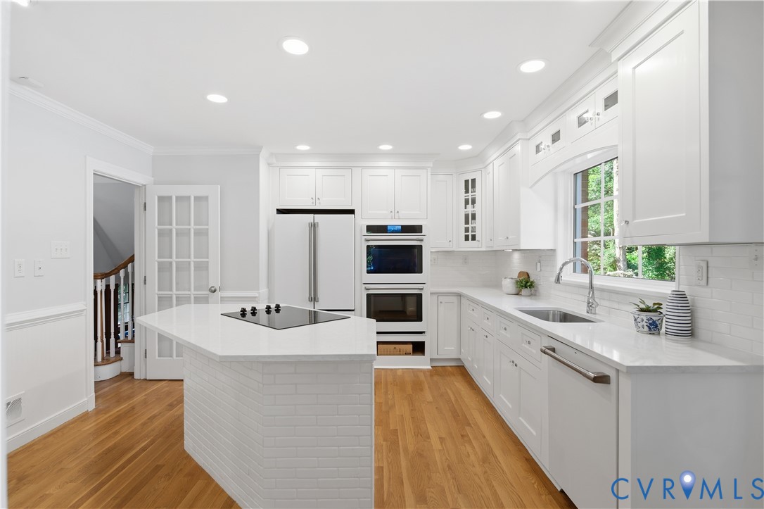 6405 Buckhill Road Richmond, VA 23225 - Photo 15 of 71 Bright kitchen featuring white cabinetry, light co