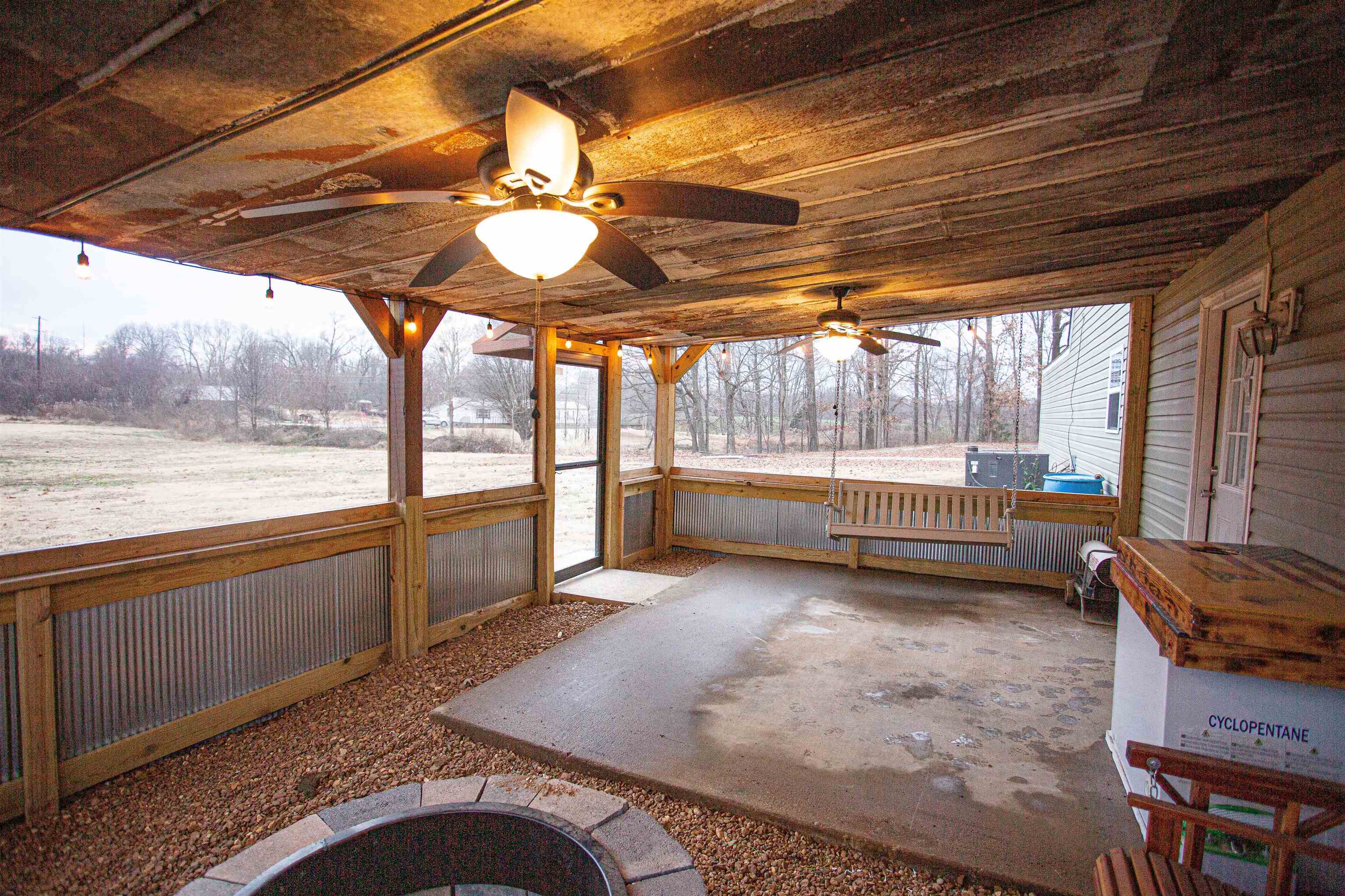 2745 Dry Hill Road West Ripley, TN 38063 - Photo 22 of 23 a view of a porch with furniture and a backyard