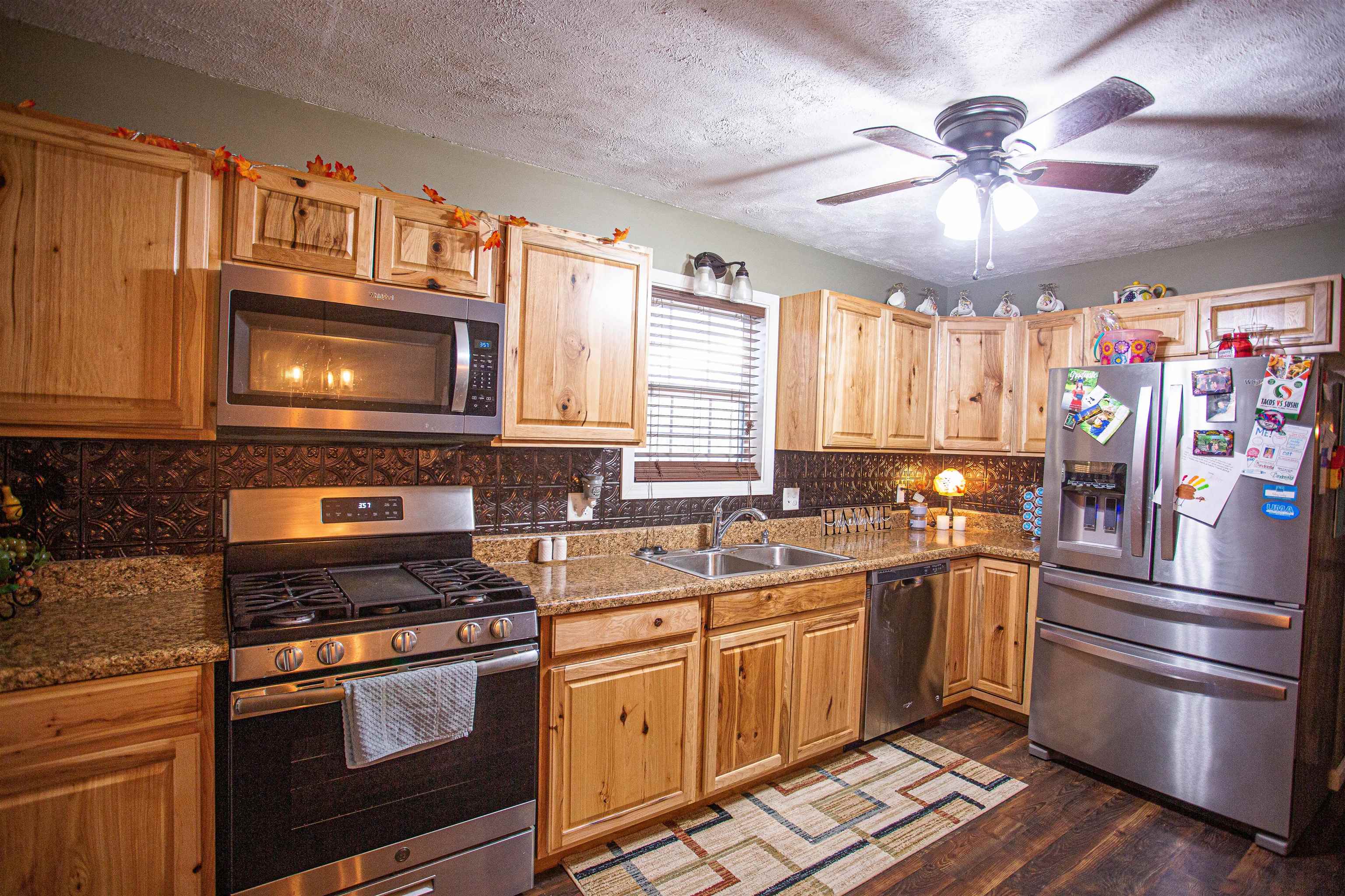 2745 Dry Hill Road West Ripley, TN 38063 - Photo 5 of 23 a kitchen with stainless steel appliances a stove a sink and a refrigerator