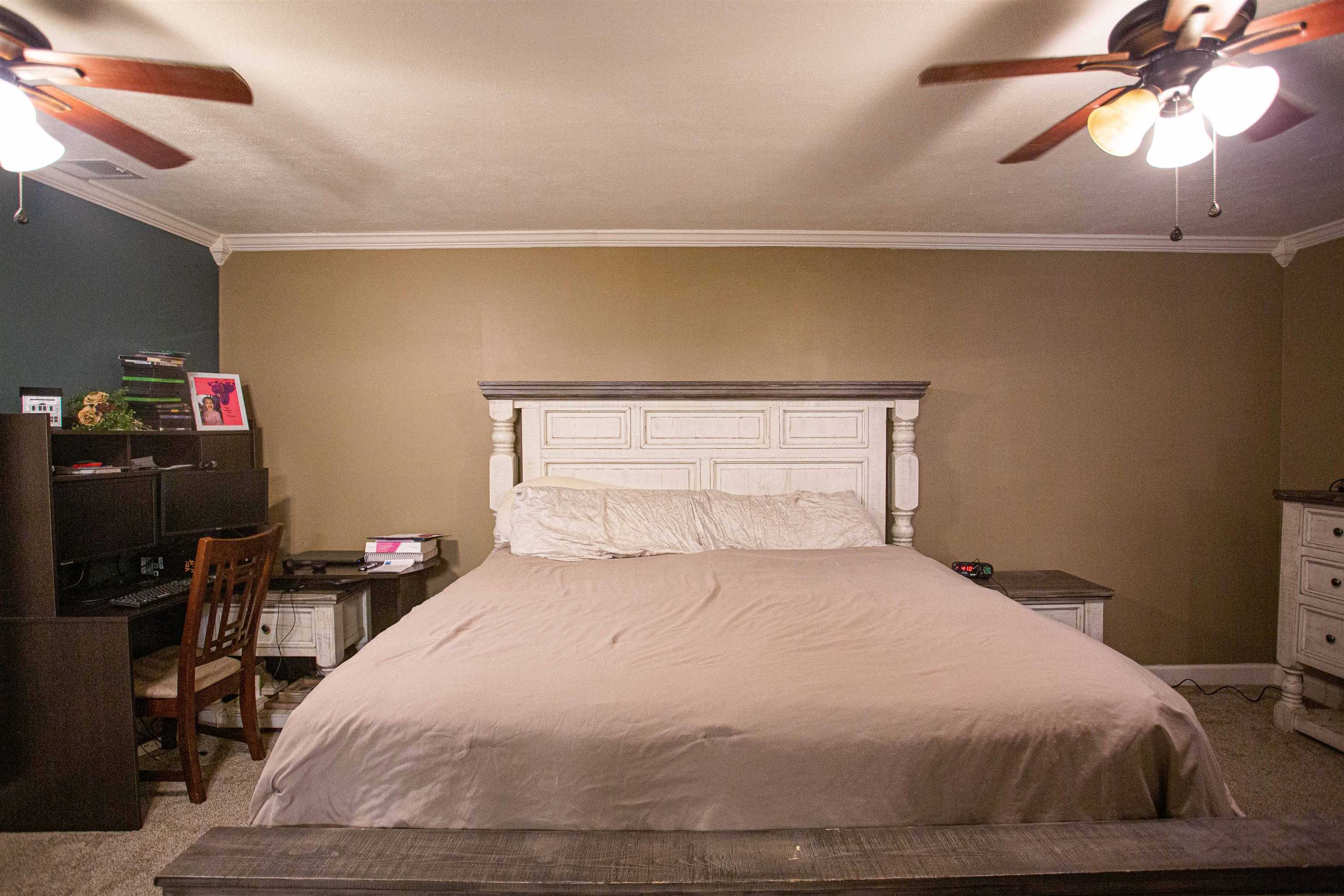 2745 Dry Hill Road West Ripley, TN 38063 - Photo 9 of 23 a bedroom with a bed and a chandelier