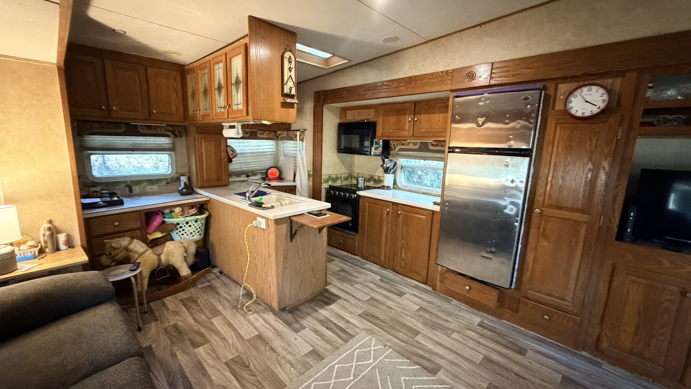 361 Medina Drive Trinity, TX 75862 - Photo 25 of 46 a view of a kitchen with fridge and wooden floor