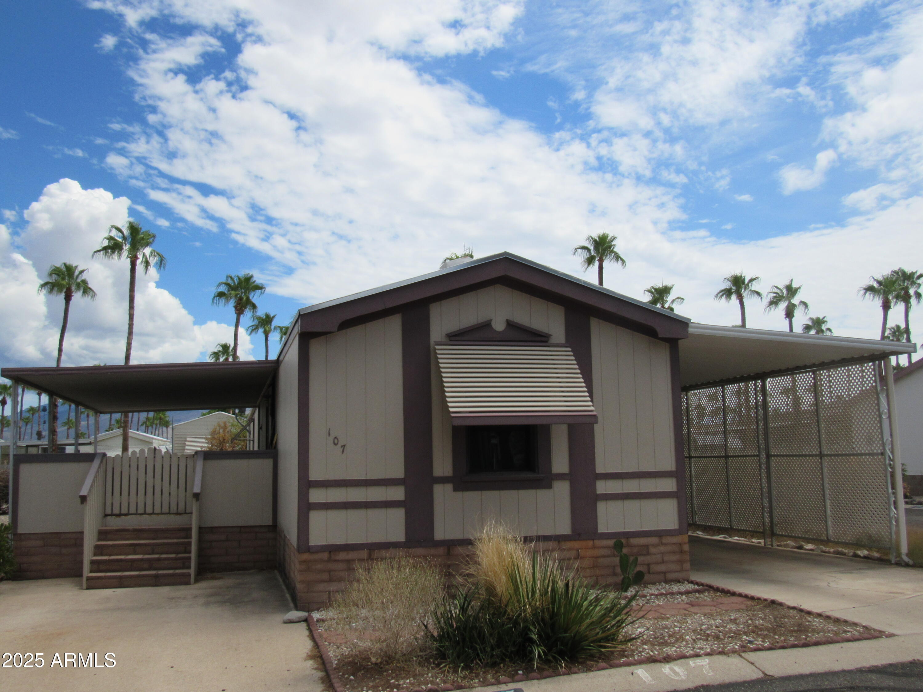 3411 South Camino Seco, Unit 107 Tucson, AZ 85730 - Photo 2 of 15 a view of a house with a balcony