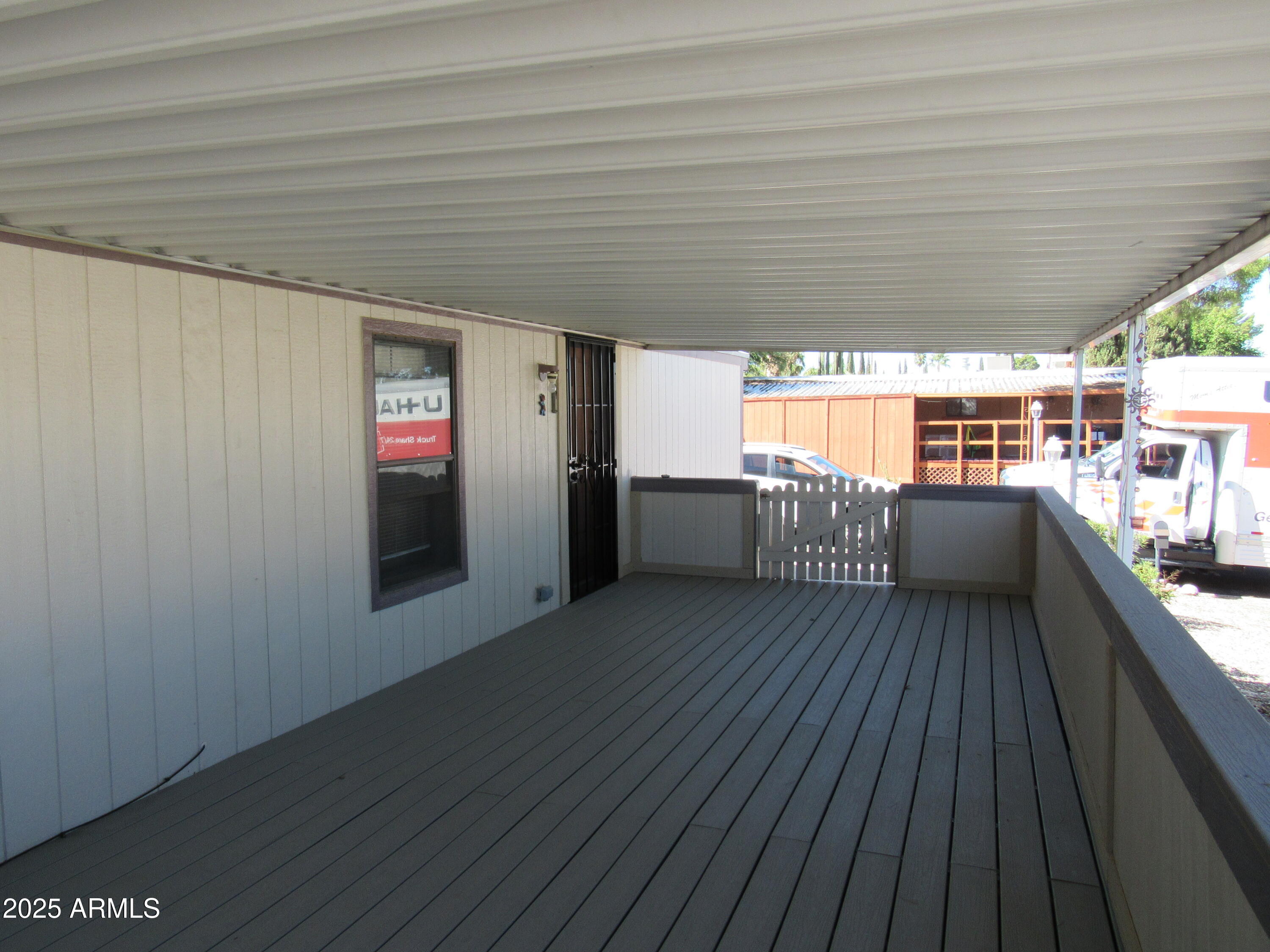 3411 South Camino Seco, Unit 107 Tucson, AZ 85730 - Photo 4 of 15 a view of a room with wooden floor
