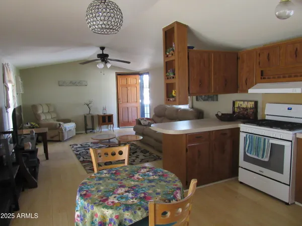 a kitchen with a stove a sink and a refrigerator