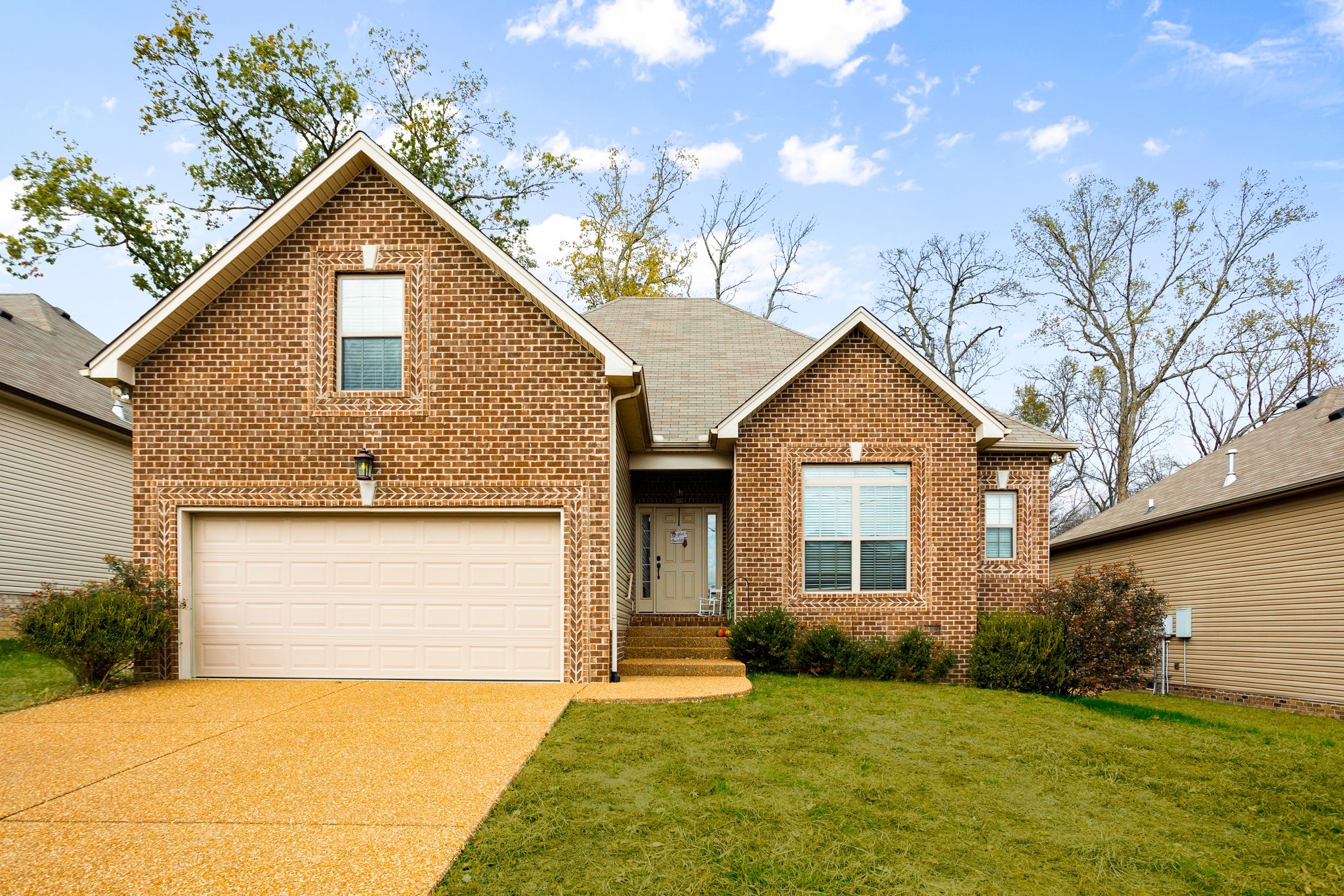 1086 Golf View Way Spring Hill, TN 37174 - Photo 1 of 25 a front view of a house with a yard and garage