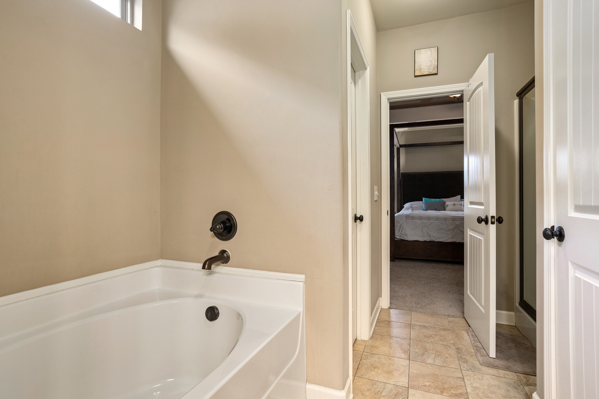1086 Golf View Way Spring Hill, TN 37174 - Photo 15 of 25 a en suite bathroom with a tub and a view of en suite bathroom