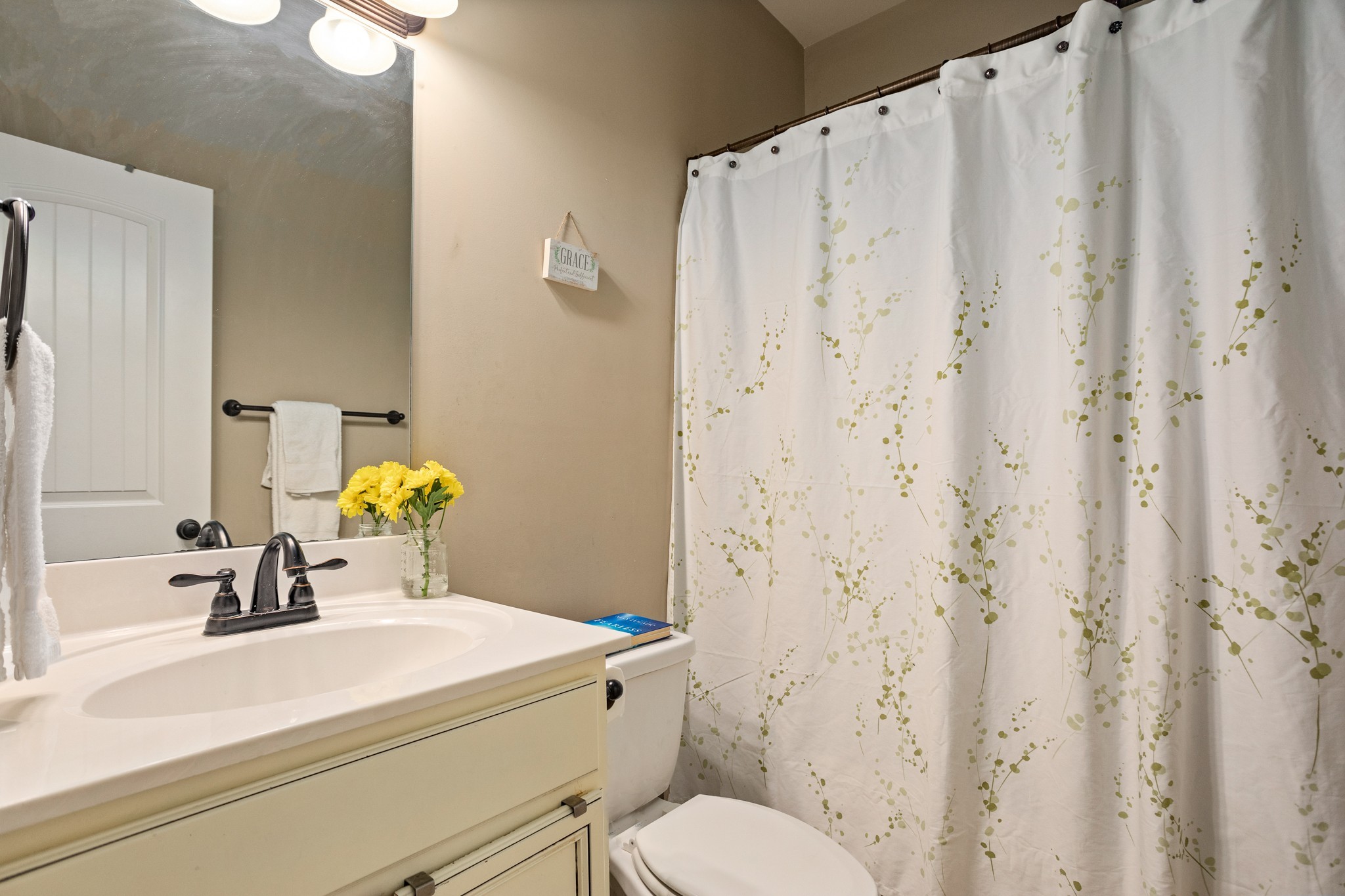 1086 Golf View Way Spring Hill, TN 37174 - Photo 17 of 25 a bathroom with a sink a toilet and a mirror