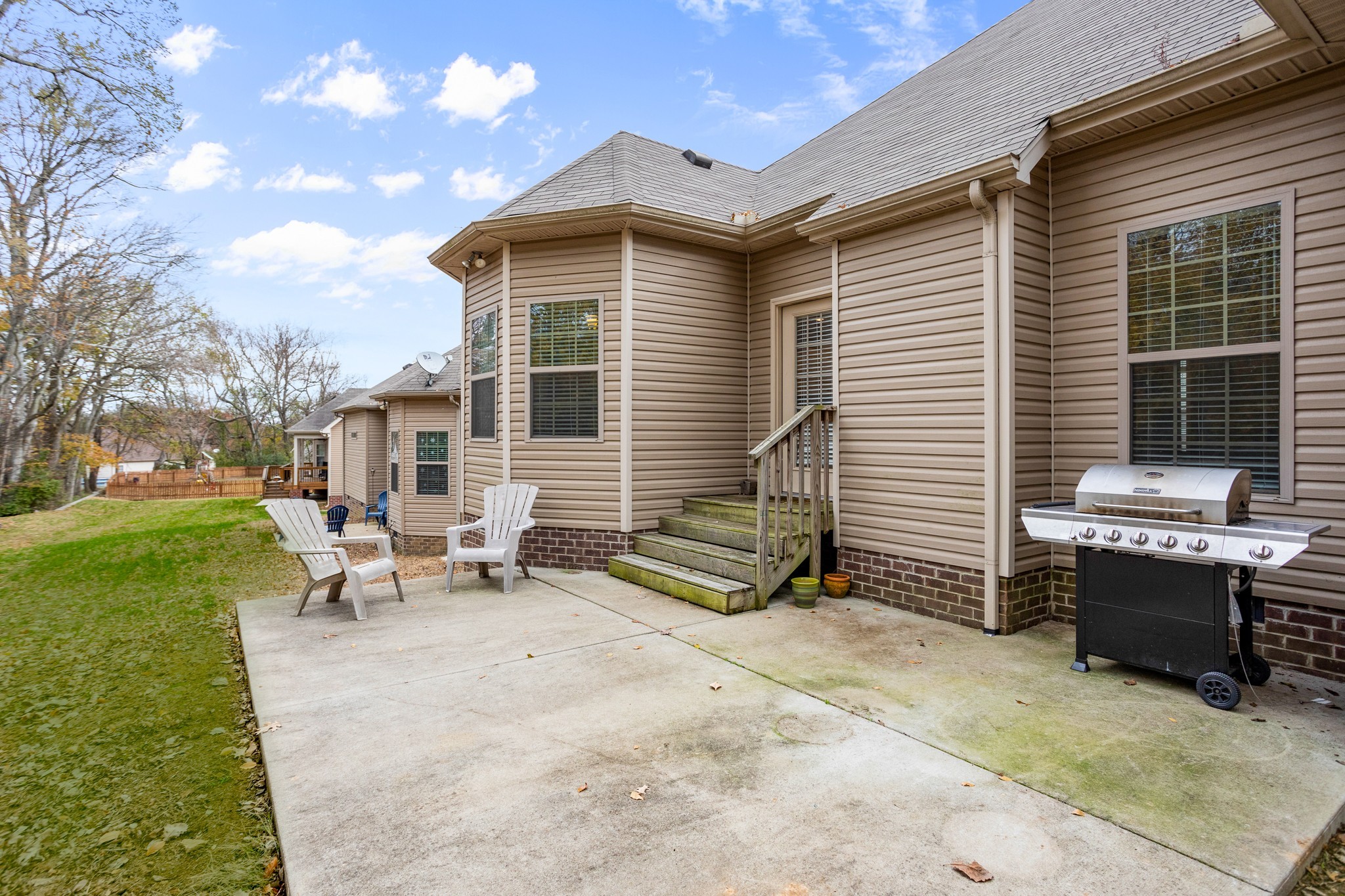1086 Golf View Way Spring Hill, TN 37174 - Photo 22 of 25 a view of a patio with a table and chairs