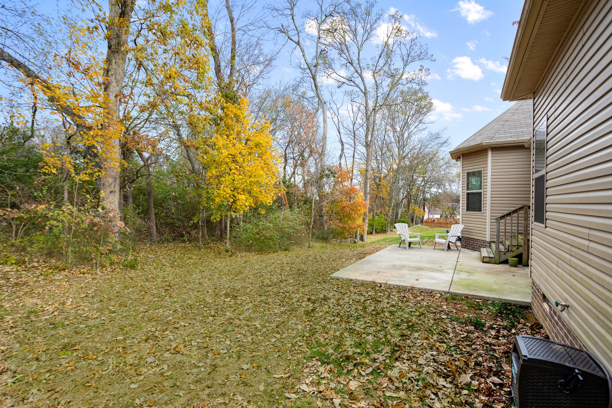 1086 Golf View Way Spring Hill, TN 37174 - Photo 23 of 25 a backyard of a house with table and chairs