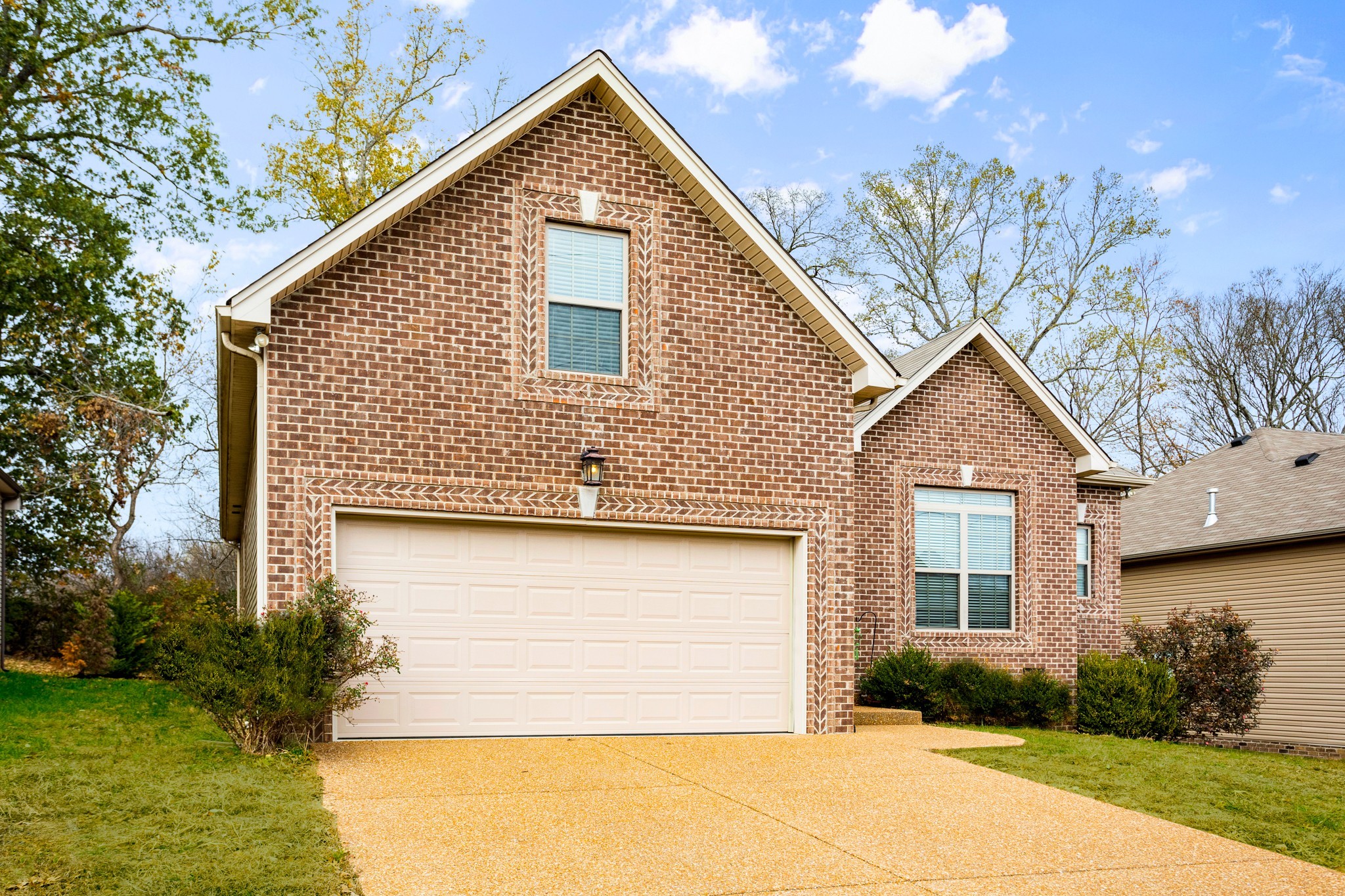 1086 Golf View Way Spring Hill, TN 37174 - Photo 3 of 25 a front view of a house with garden