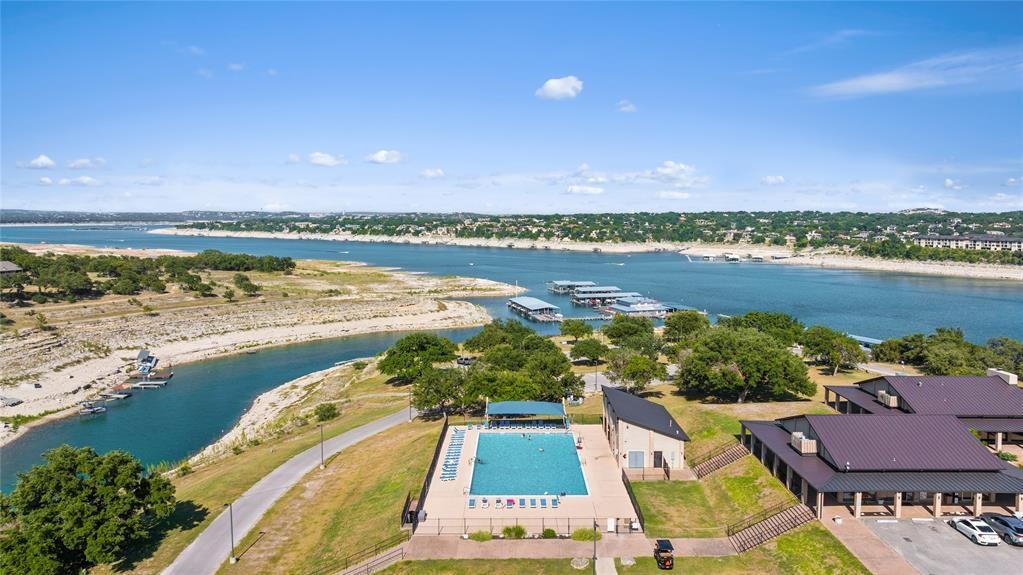18804 Venture Drive Point Venture, TX 78645 - Photo 8 of 24 a view of a city and an ocean view
