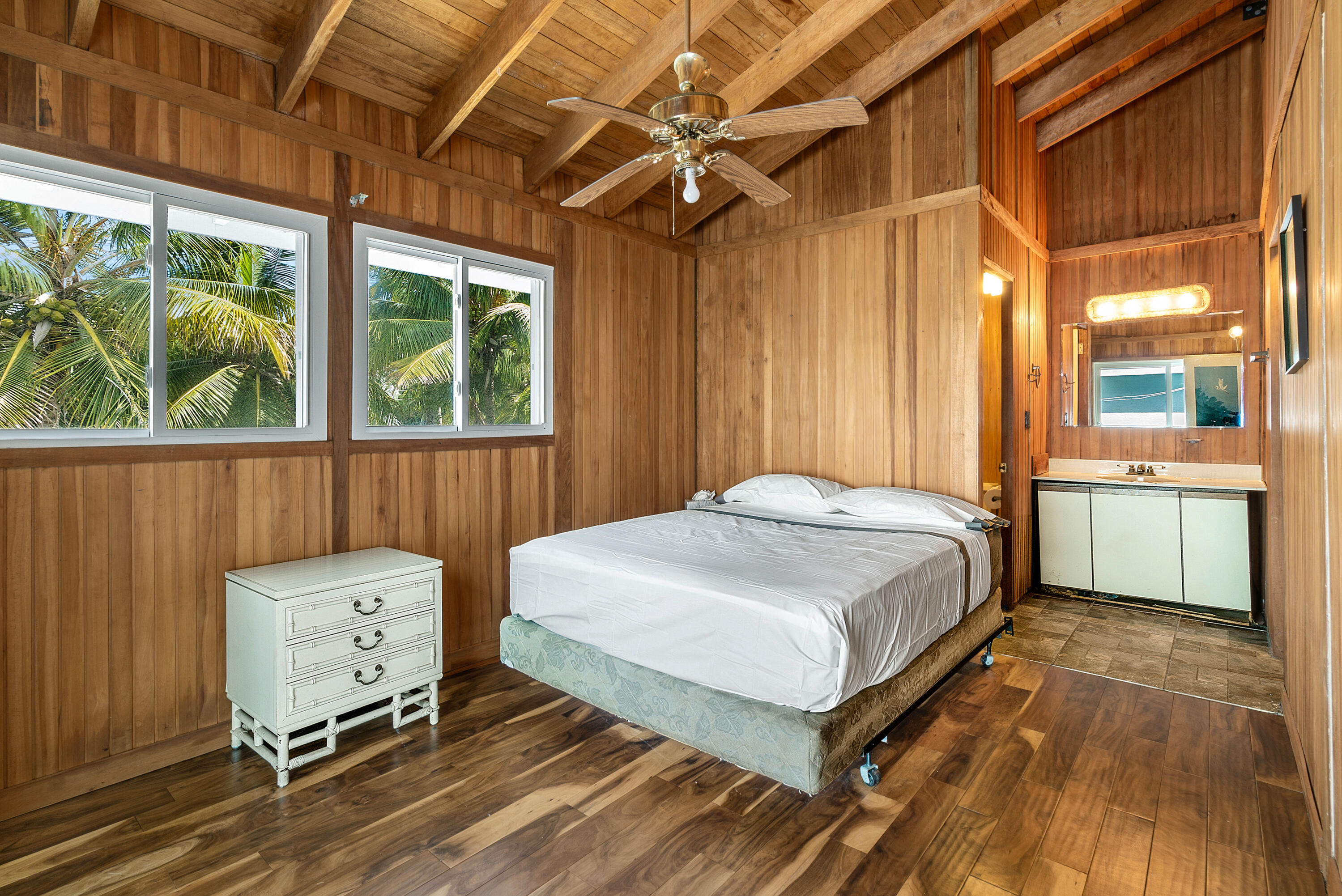 18 North Channel Drive Key Largo, FL 33037 - Photo 13 of 40 a bedroom with a bed and large windows