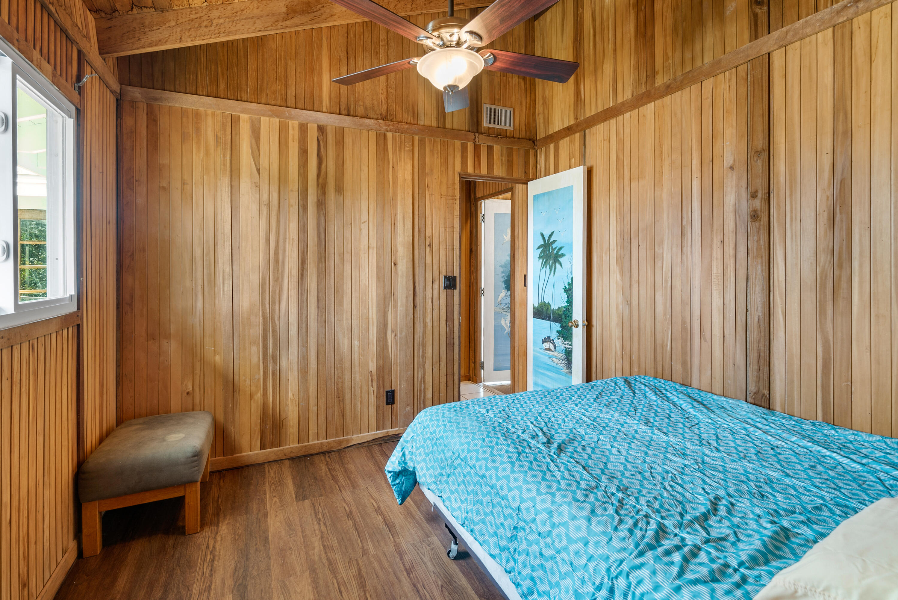 18 North Channel Drive Key Largo, FL 33037 - Photo 18 of 40 a bedroom with a bed and a chandelier