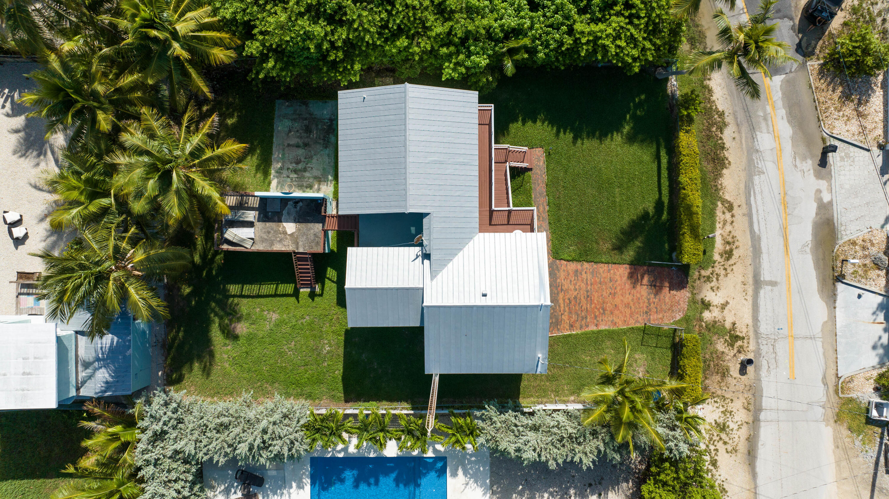 18 North Channel Drive Key Largo, FL 33037 - Photo 25 of 40 an aerial view of a house with garden space and a tree