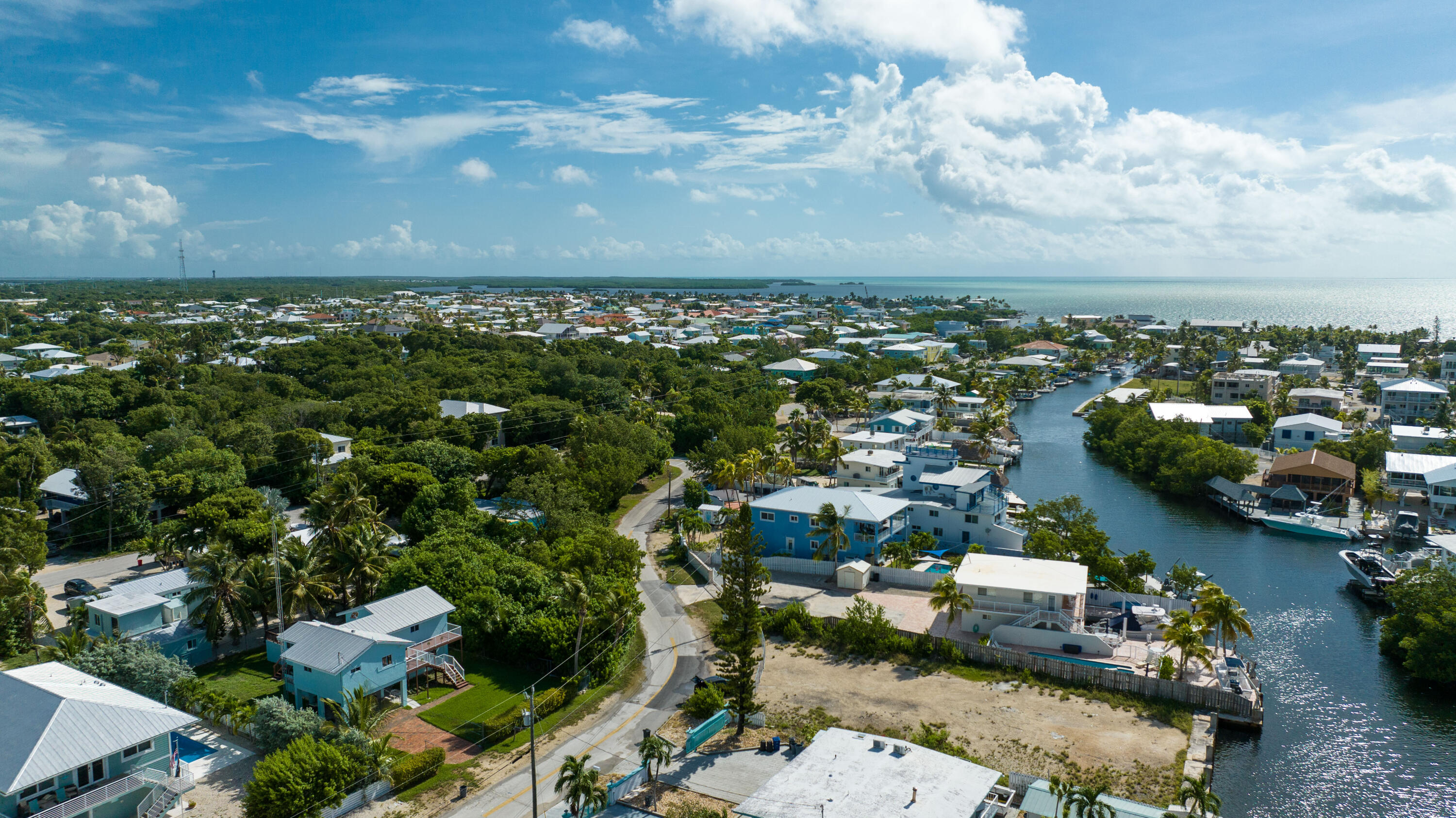 18 North Channel Drive Key Largo, FL 33037 - Photo 32 of 40 an aerial view of a city with lots of residential buildings ocean and mountain view in back