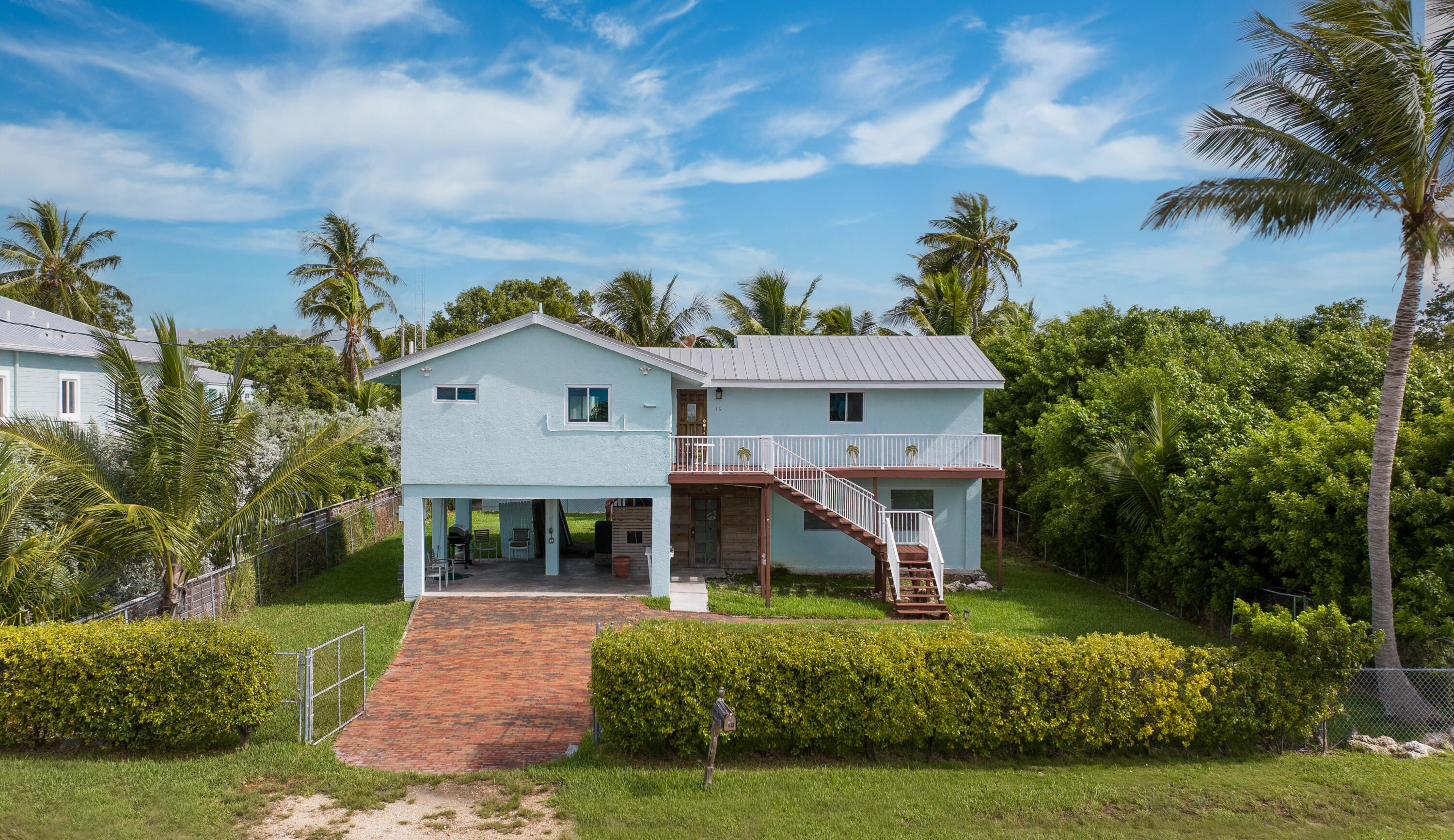 18 North Channel Drive Key Largo, FL 33037 - Photo 34 of 40 a view of house with garden and tall trees