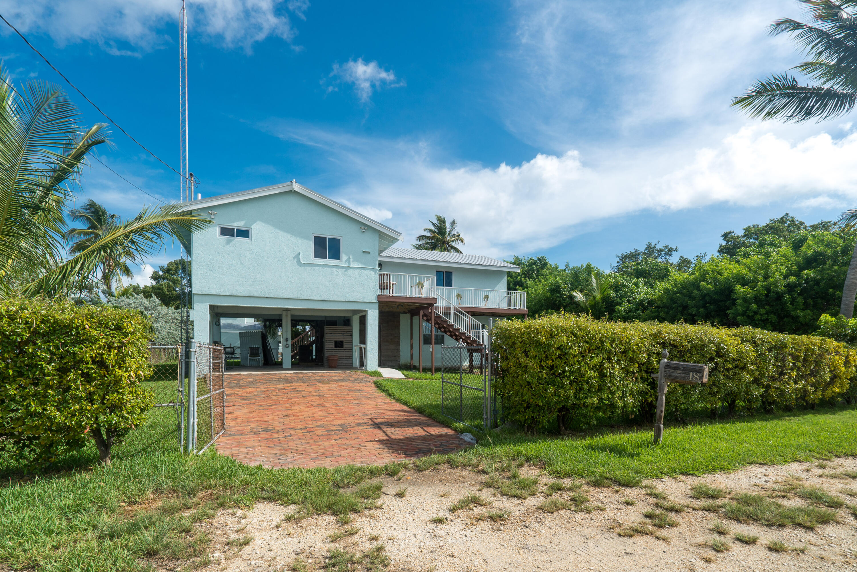 18 North Channel Drive Key Largo, FL 33037 - Photo 35 of 40 a front view of a house with garden