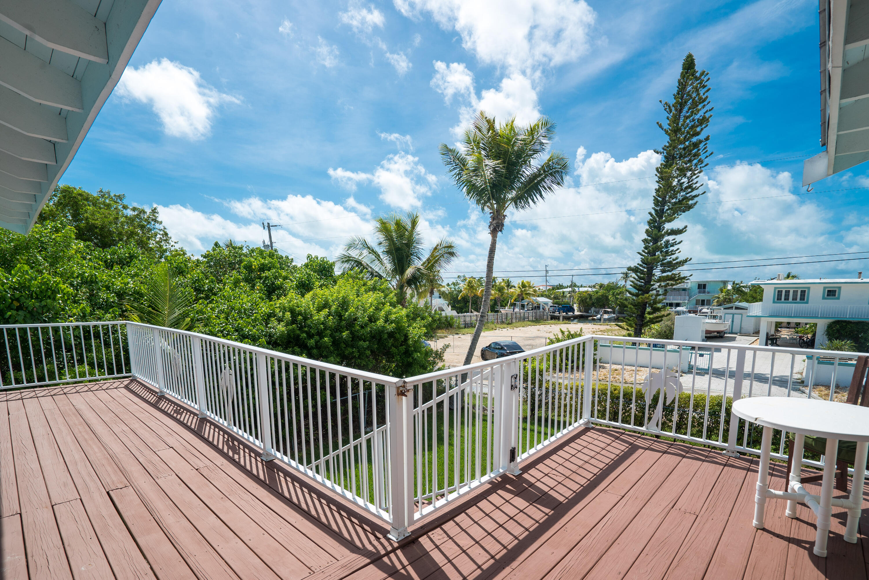 18 North Channel Drive Key Largo, FL 33037 - Photo 37 of 40 a view of balcony with furniture and wooden floor