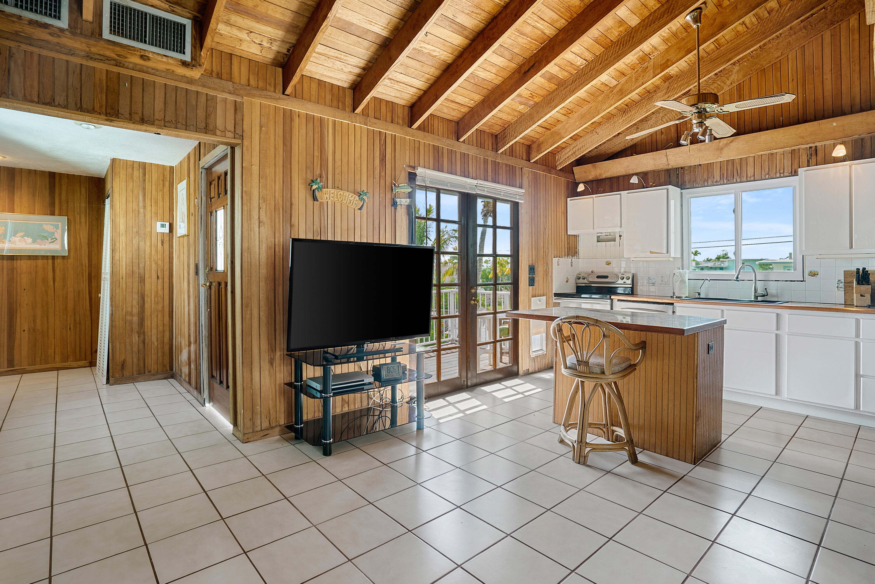 18 North Channel Drive Key Largo, FL 33037 - Photo 3 of 40 a living room with furniture and flat screen tv