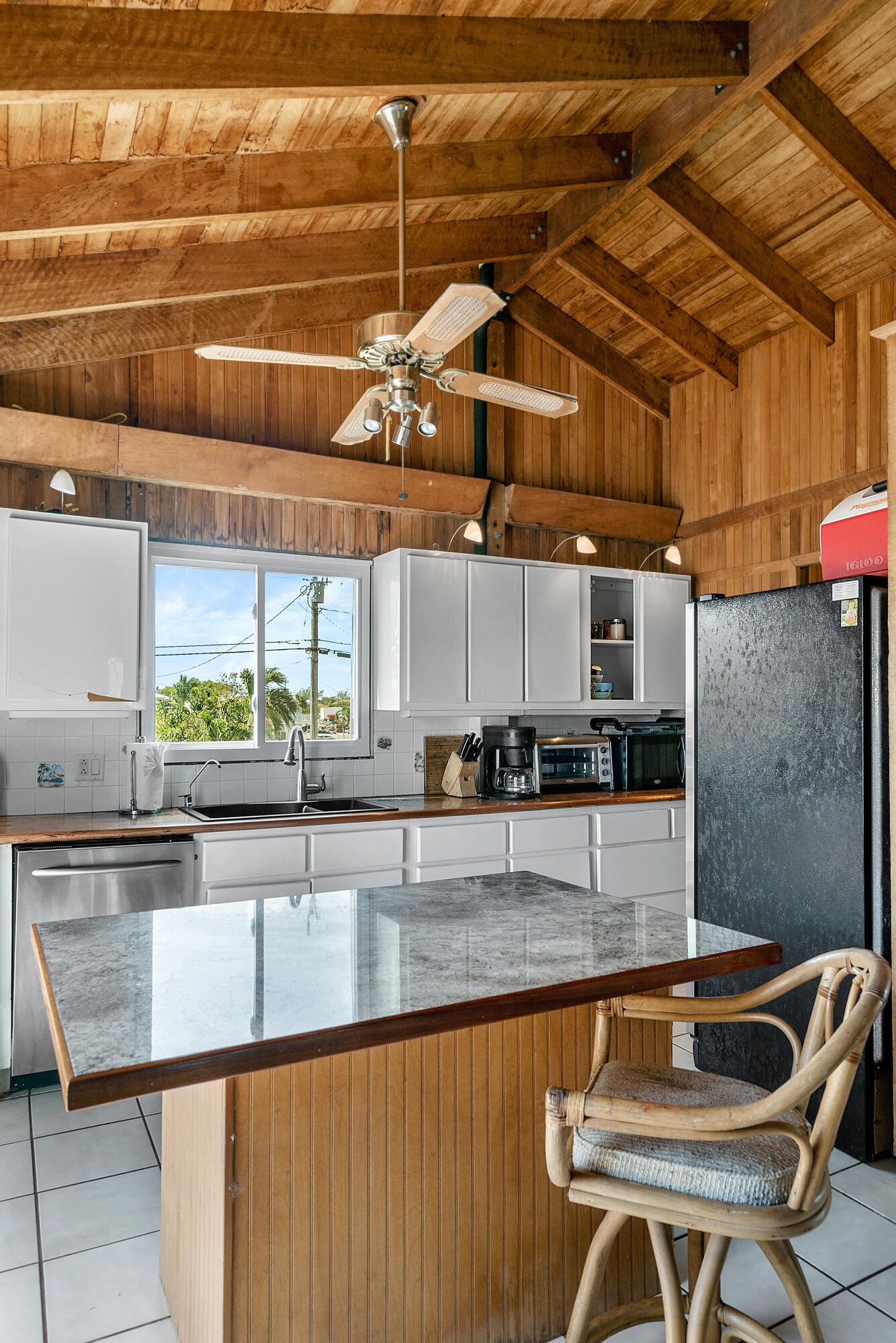 18 North Channel Drive Key Largo, FL 33037 - Photo 5 of 40 a kitchen with stainless steel appliances granite countertop a sink and cabinets