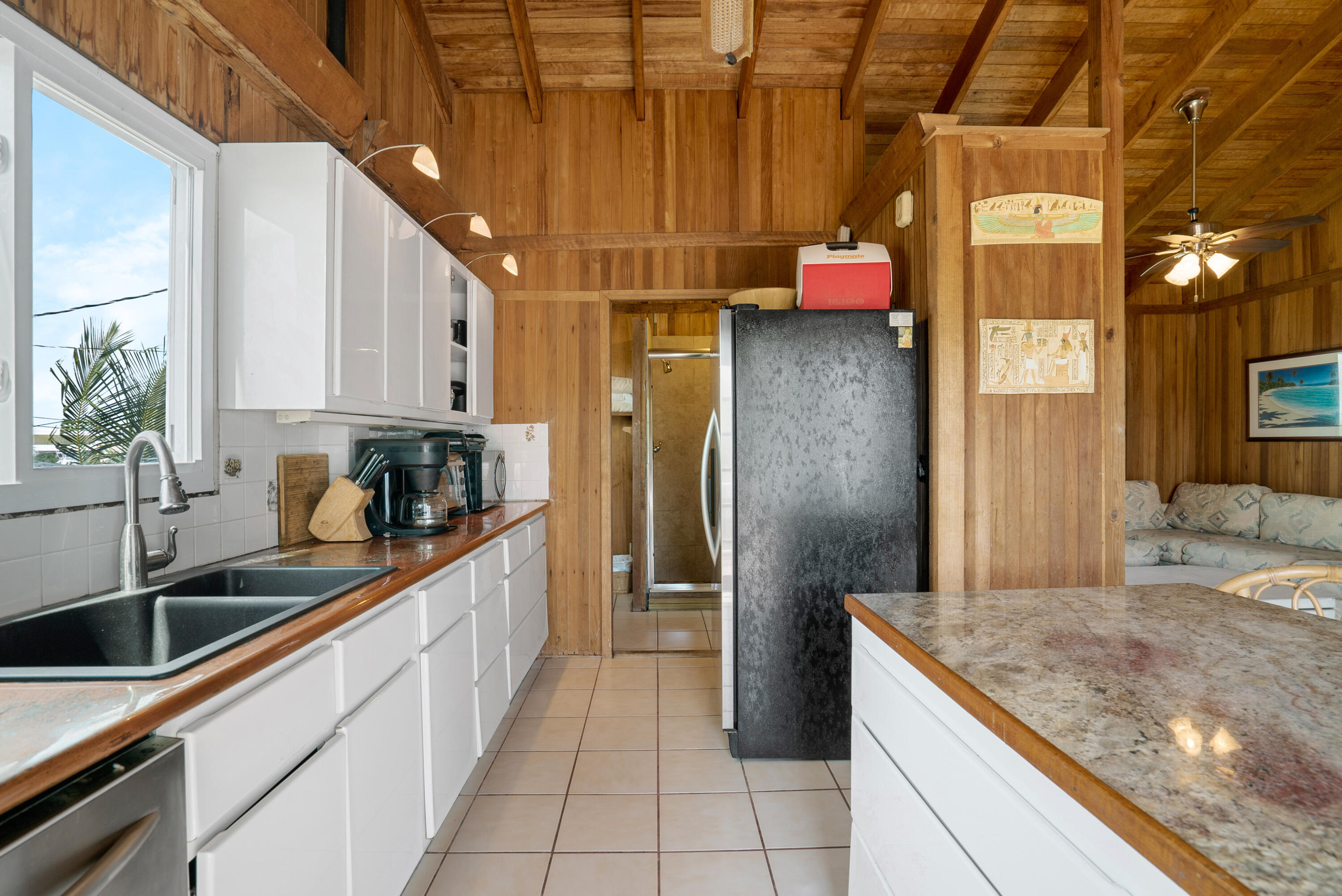18 North Channel Drive Key Largo, FL 33037 - Photo 6 of 40 a kitchen with stainless steel appliances granite countertop a sink and cabinets