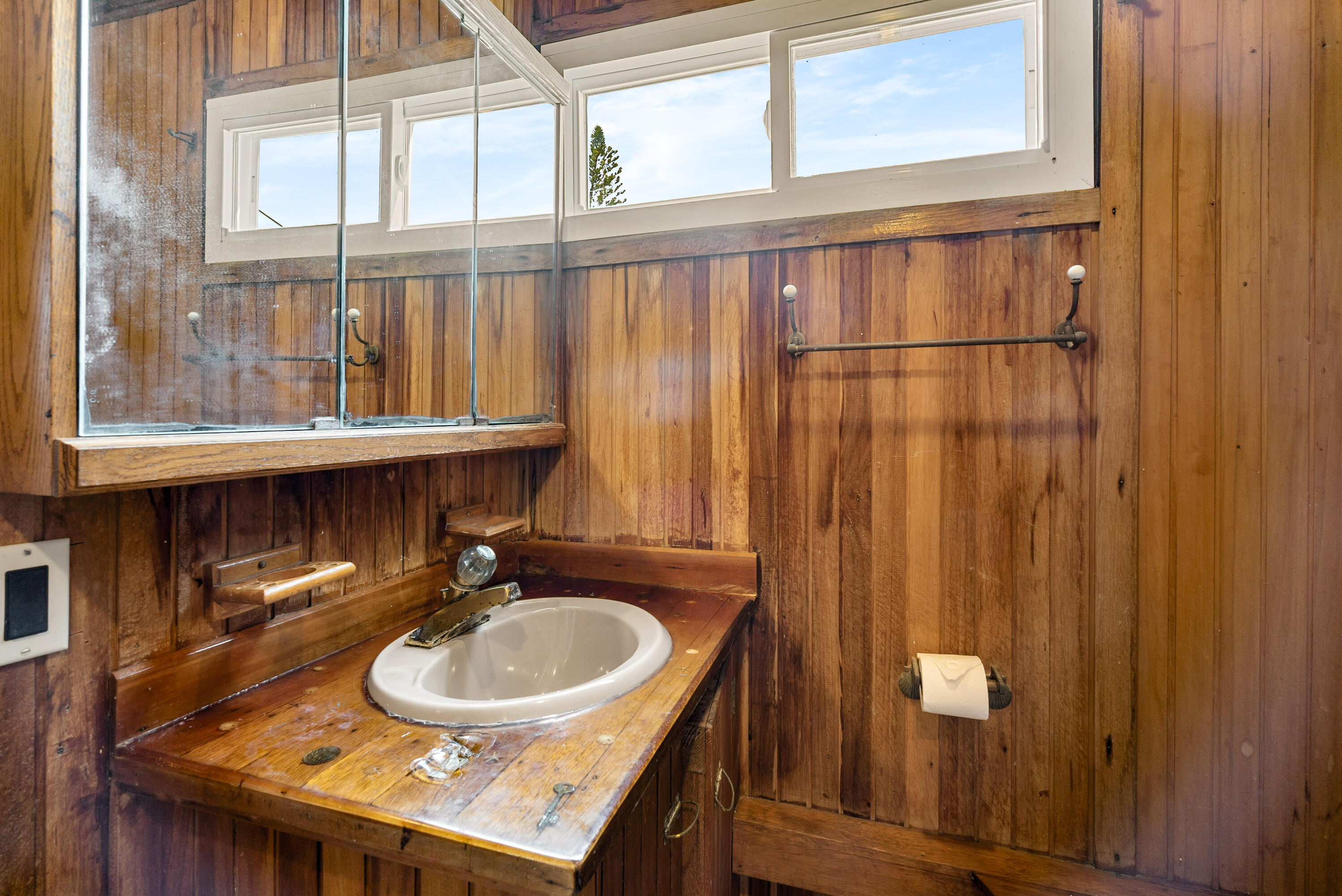 18 North Channel Drive Key Largo, FL 33037 - Photo 8 of 40 a bathroom with a sink a mirror and a window