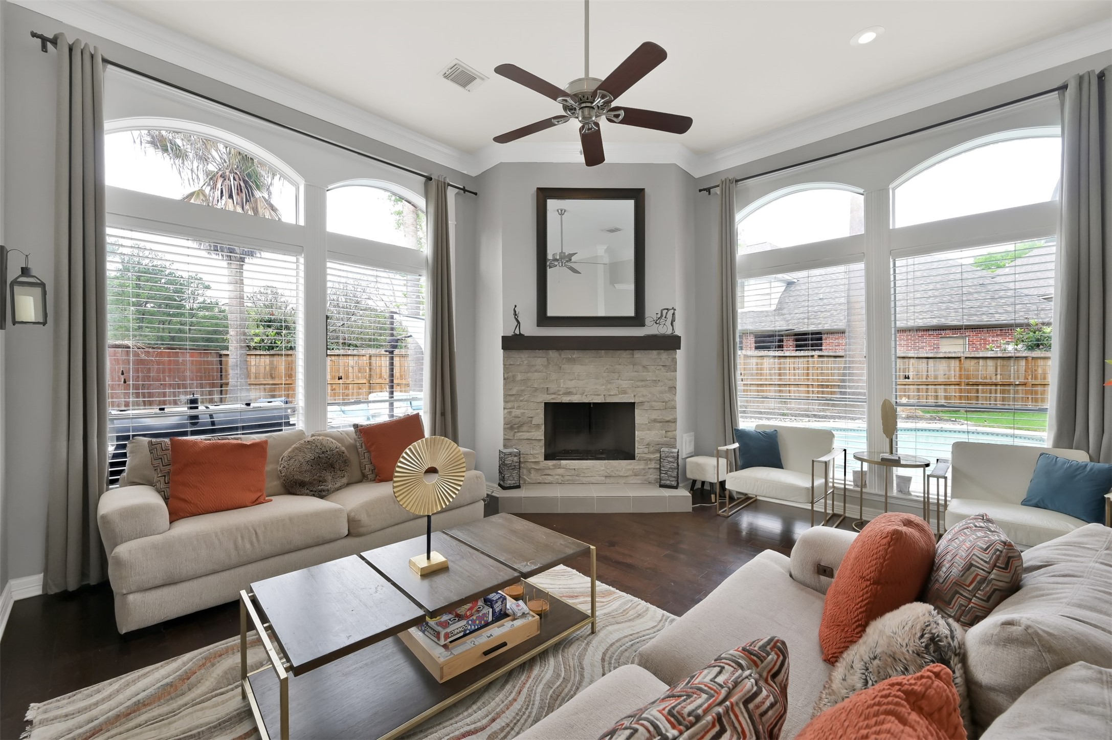 9706 Chipstead Court Spring, TX 77379 - Photo 21 of 44 Natural light? Check. Beautiful views of your pool? Check. Picturesque fireplace? Check.