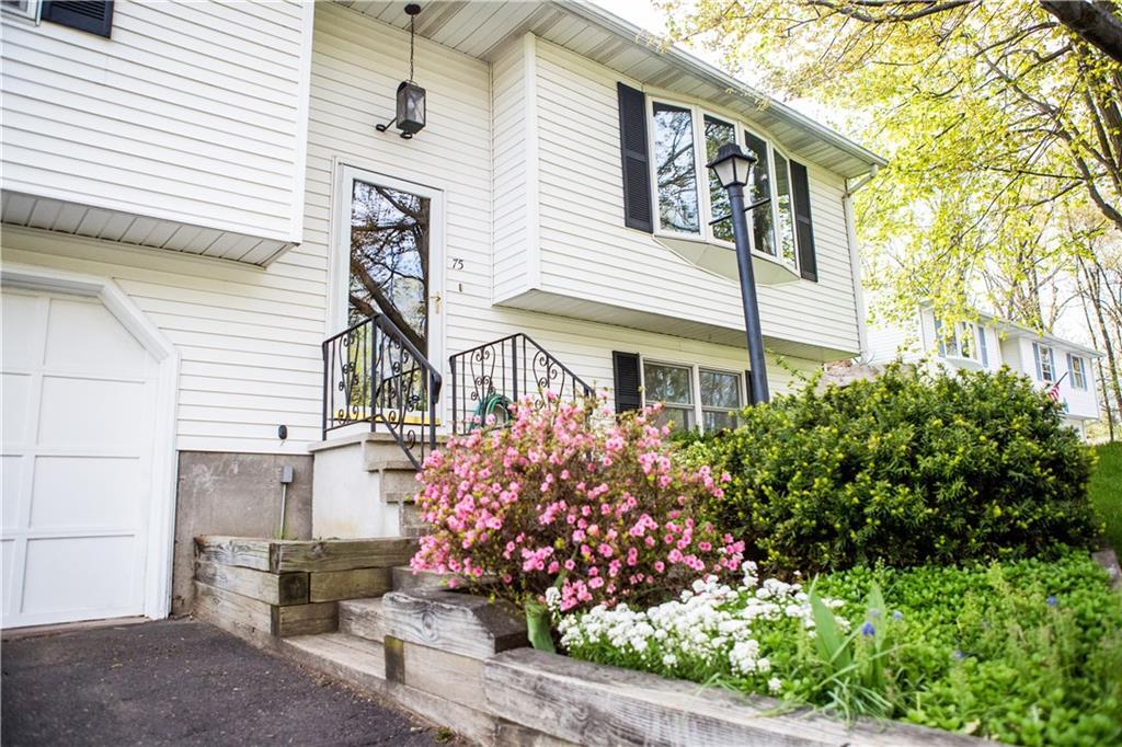 75 Ridge Road Enfield, CT 06082 - Photo 1 of 1 a front view of a house with a garden