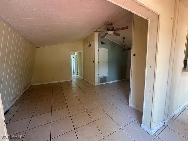 a kitchen with stainless steel appliances a sink stove and cabinets