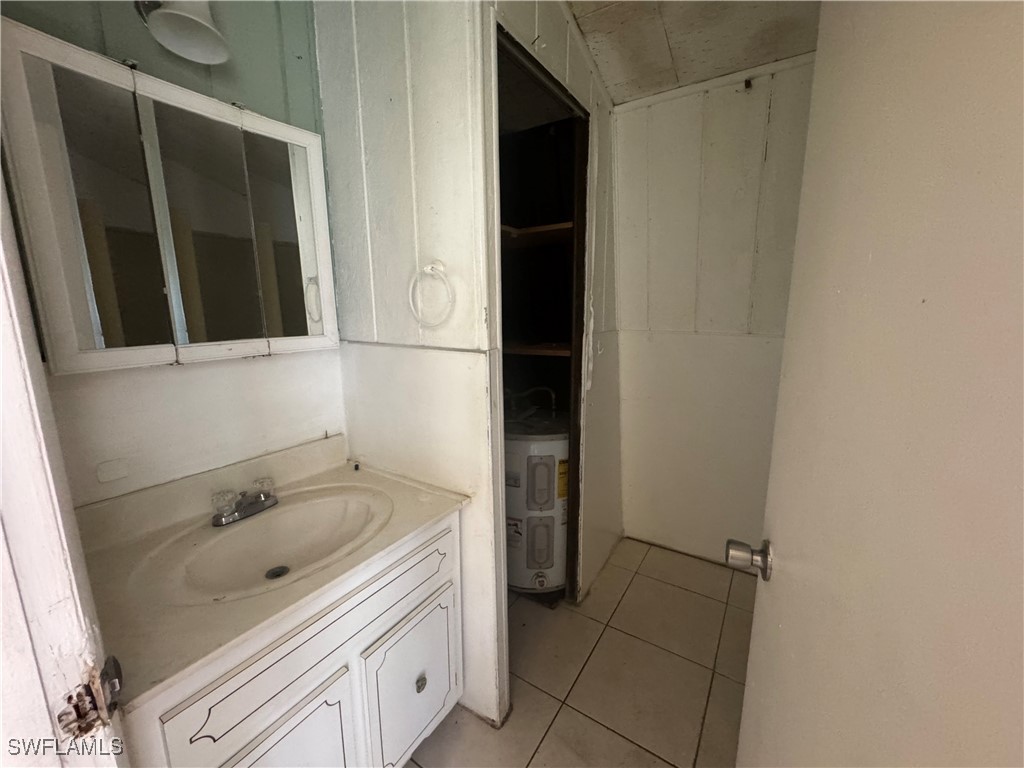 1349 Shawnee Avenue LaBelle, FL 33935 - Photo 8 of 10 a bathroom with a sink and a mirror