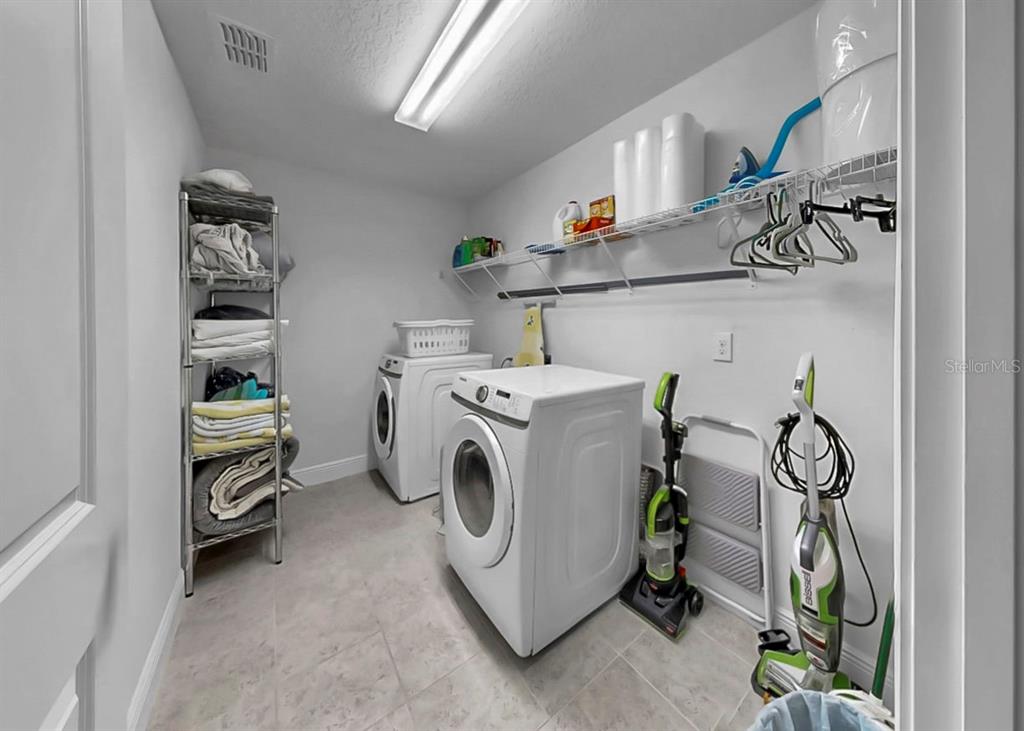10212 Newel Valley Loop Riverview, FL 33569 - Photo 13 of 72 a utility room with dryer and washer