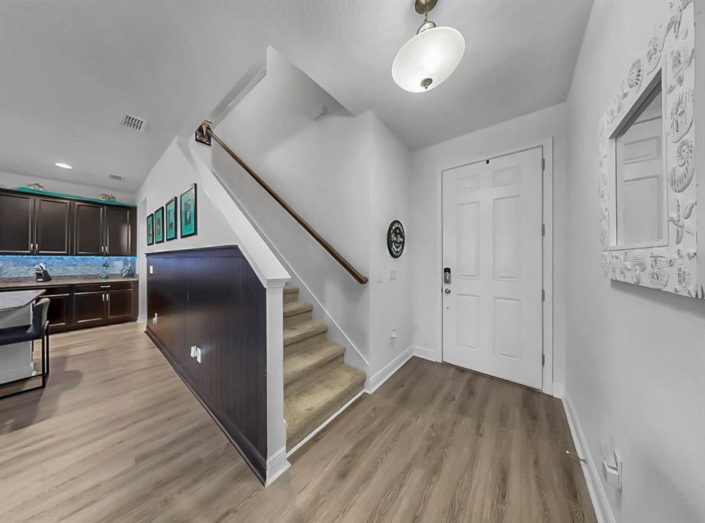 10212 Newel Valley Loop Riverview, FL 33569 - Photo 29 of 72 a view of a hallway with wooden floor and staircase
